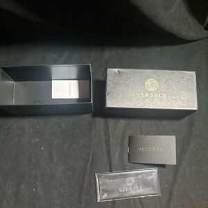 Versace sunglasses box with accessories and paperwork